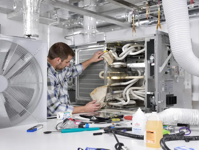 Fairhaven Air Duct Cleaning specialist performing precision AC coil cleaning in Fairhaven