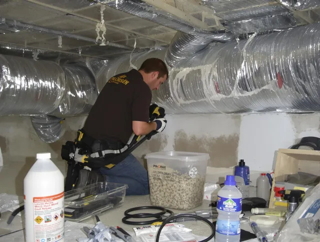 Fairhaven Air Duct Cleaning specialist performing professional mold removal from air ducts in Fairhaven