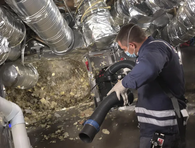 Fairhaven Air Duct Cleaning specialist operating negative pressure cleaning equipment for thorough duct maintenance in Fairhaven