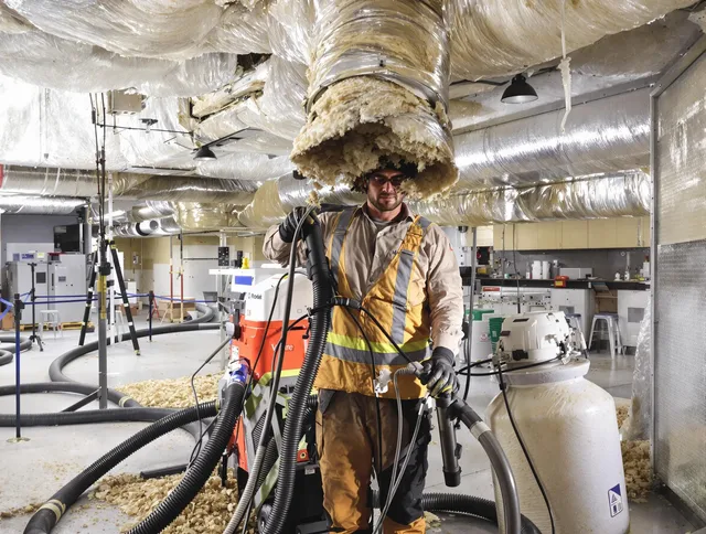Professional vacuum insulation removal by Fairhaven Air Duct Cleaning expert in Fairhaven